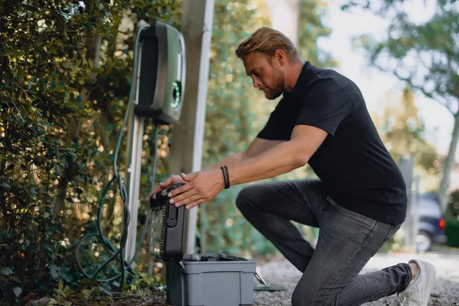 Technician installing an EV charge point