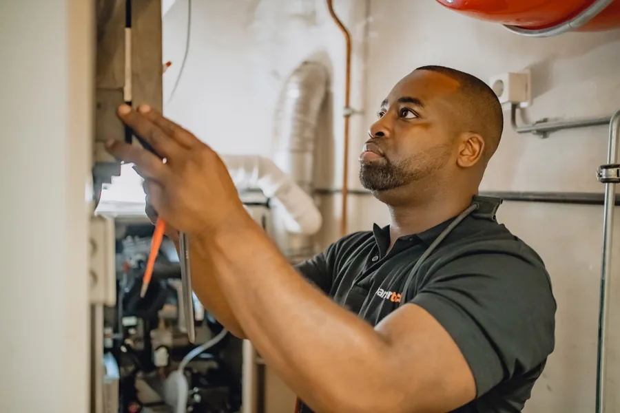 Technician working on telecom equipment