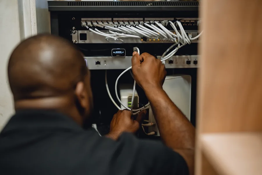 Technician installing home internet equipment